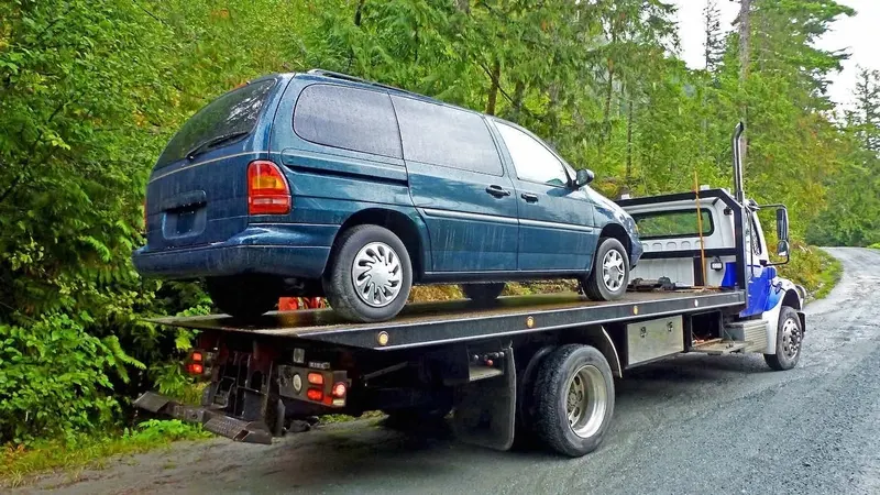 Vancouver flatbed towing a cargo van