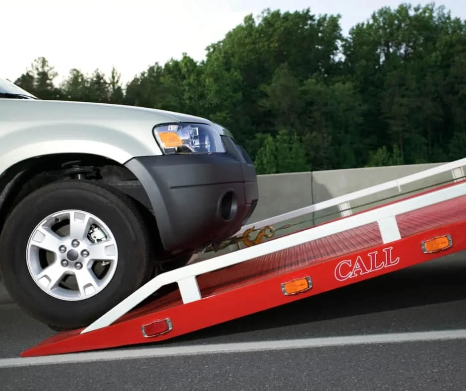 Vancouver tow truck loading a vehicle on a residential street