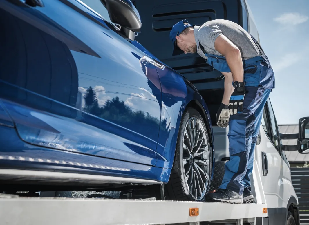 Richmond tow truck operator loading vehicle